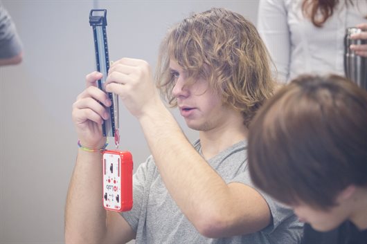 An Illinois Physics student takes a measurement using the IOLab, during a pilot study in the Fall 2015