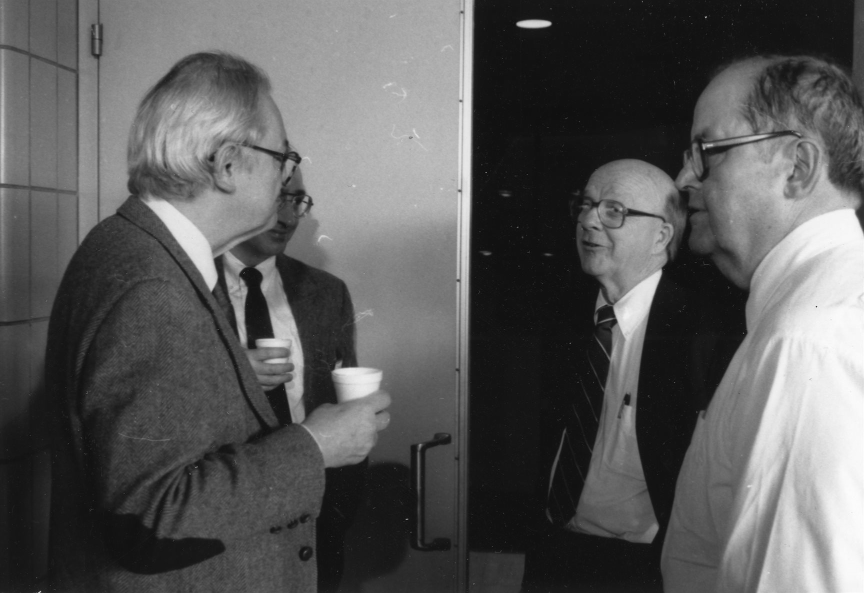 Charles Slichter, David McCall, and William Slichter (Charles&rsquo; brother) converse at a meeting, undated. Department of Physics, University of Illinois at Urbana-Champaign, courtesy of Emilio Segr&egrave; Visual Archives of the American Institute of Physics