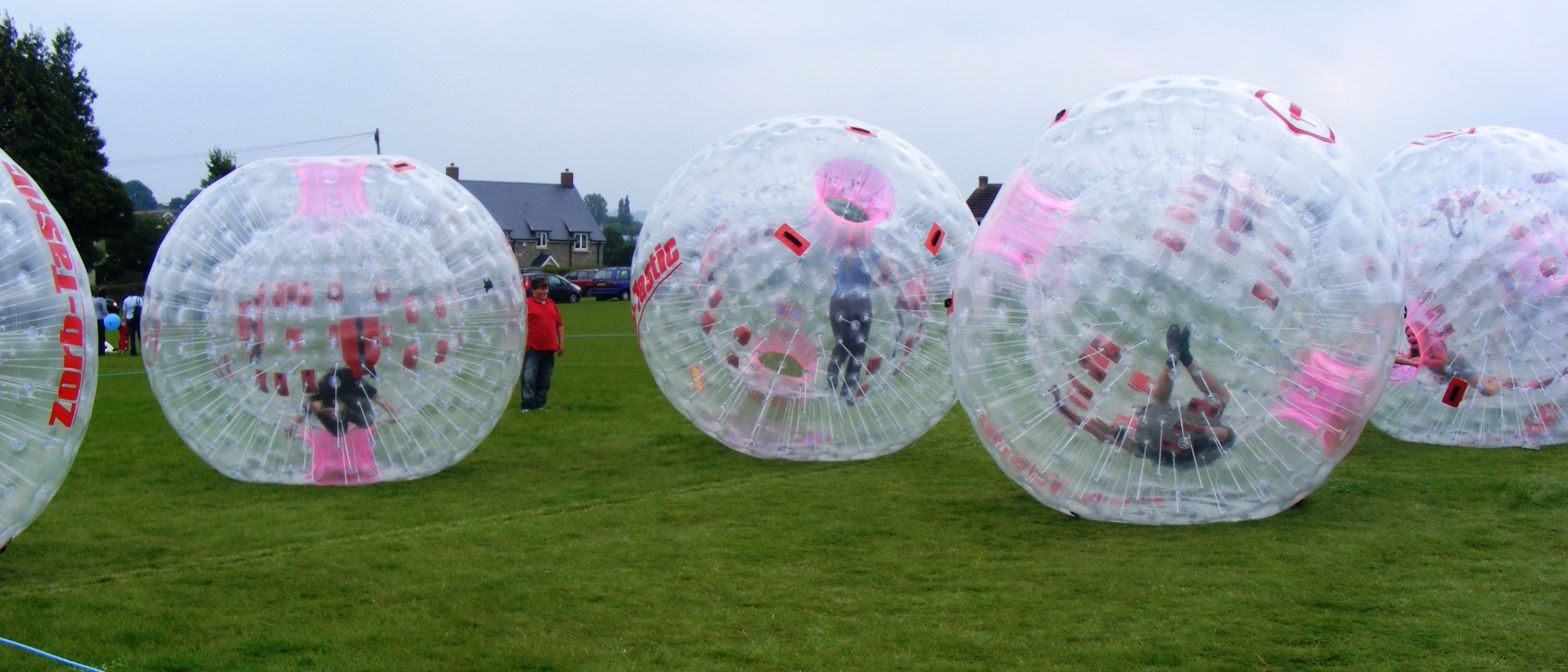 Zorbing, rolling and bouncing in an inflated transparent ball, has become popular around the world. Bikash Padhi, a University of Illinois at Urbana-Champaign graduate student in theoretical condensed matter physics, compares Wigner crystallization to swelling zorbs in a closed field, where the zorb passengers are electrons and the zorb itself is a measure of each electron&rsquo;s repulsion to other electrons. Credit: Username:Rodw/Wikimedia Commons/Public Domain