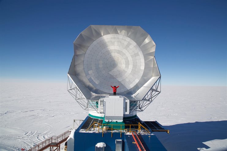 U of I astronomy graduate student Andrew Nadolski stands in front of the South Pole Telescope in Antarctica. Nadolski was stationed at the South Pole for the first year after installation of the third-generation camera on the telescope. Photo courtesy of Andrew Nadolski