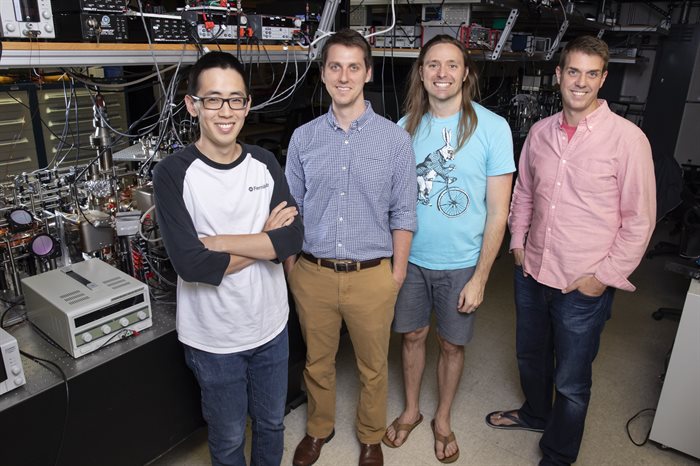 Professors Bryce Gadway (far right) and Taylor Hughes (second from right) pose with graduate students Alex An (far left) and Eric Meier, in Gadway&rsquo;s lab at the Loomis Laboratory of Physics. &lt;br /&gt;Photo by L. Brian Stauffer, University of Illinois at Urbana-Champaign