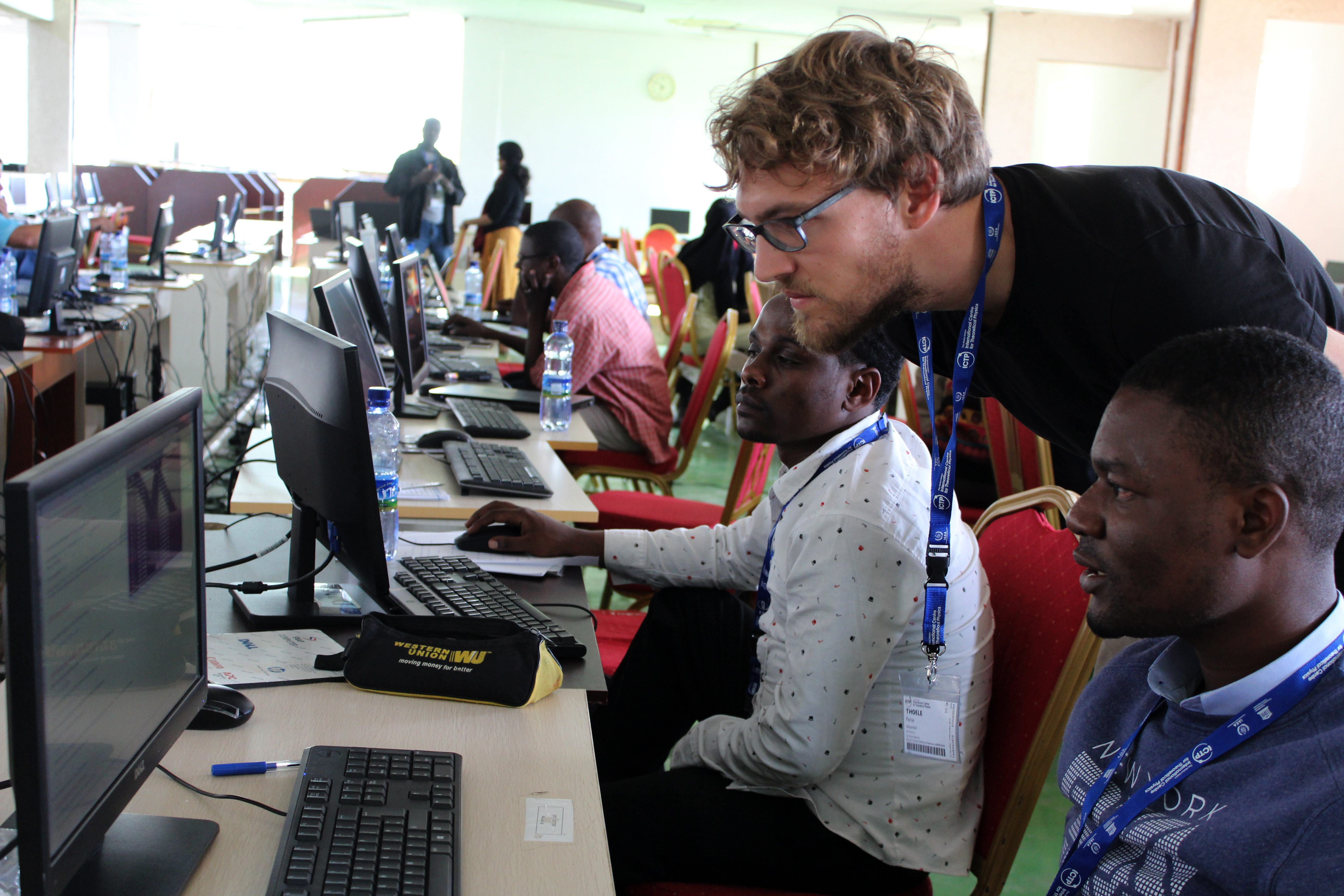 An ASESMA mentor provides one-on-one tutoring to participants