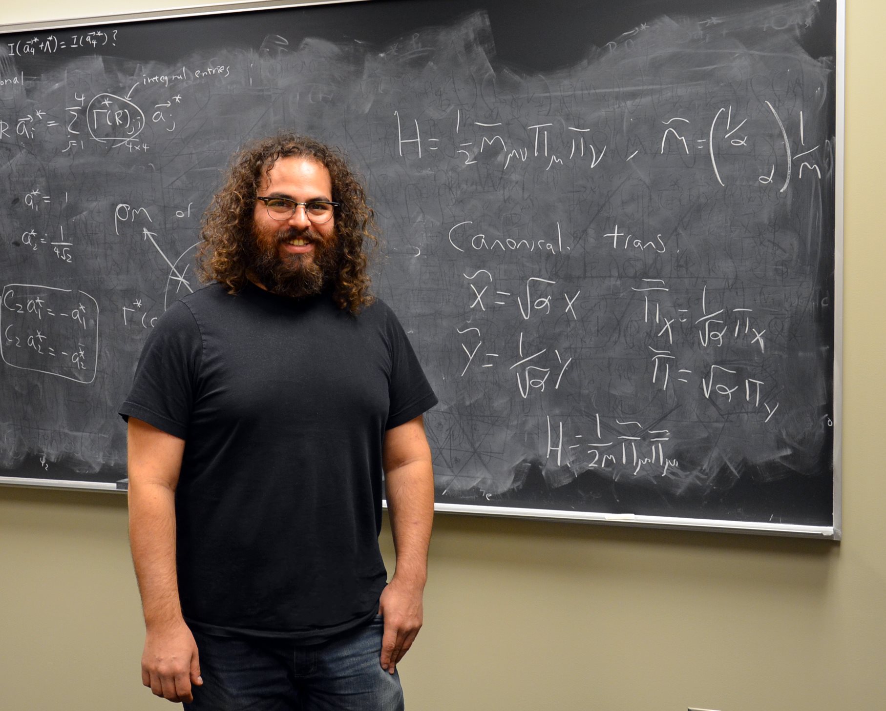 Illinois Physics Professor Barry Bradlyn poses in his office at the Institute for Condensed Matter Physics in Urbana. Photo by Siv Schwink for Illinois Physics