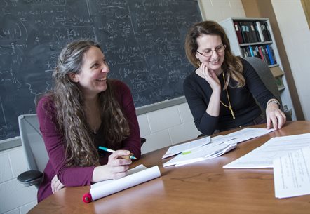 Illinois Physics Professors Jessie Shelton and Aida El-Khadra collaborate in Shelton's office in Loomis Laboratory.