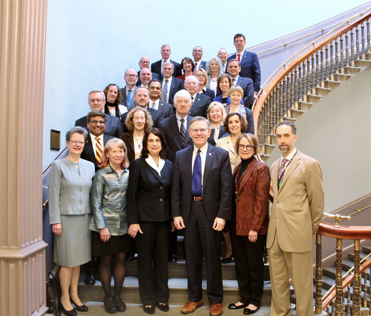John Veysey (front row, far right) stands with members of the National Science Board (NSB) and the President&rsquo;s Council of Advisors on Science and Technology (PCAST) under the Trump administration, in the Eisenhower Executive Office Building in Washington, D.C. Pictured are (front row, left to right) Julia Phillips (NSB), Geri Richmond (NSB), Diane Souvaine (then NSB chair), Kelvin Droegemeier (then director of the White House&rsquo;s Office of Science and Technology Policy, PCAST chair), Catherine Bessant (PCAST), and John Veysey; (Row 2) Sethuraman Panchanathan (now National Science Foundation director, then NSB), K. Birgitta Whaley (PCAST), France C&oacute;rdova (former NSF director and NSB); (Row 3) John Anderson (NSB, now president National Academy of Engineering), Shannon D. Blunt (NSB), Roger Beachy (NSB), Anneila Sargent (NSB); (Row 4) Maureen Condic (NSB), Suresh Garimella (NSB), Arthur &ldquo;Artie&rdquo; Bienenstock (NSB), Maria Zuber (NSB, now chair of PCAST); (Row 5) Dan Reed &nbsp;(NSB), Steven Leath (NSB), Bob Groves (NSB), Dorota Grejner-Brzezinska (NSB), Ellen Ochoa (then NSB vice-chair, now chair); (Row 6) Shane Wall (PCAST), Sharon Hrynkow (PCAST), Vicki Chandler (NSB), A.N. Sreeram (PCAST); (Row 7) G.P. &ldquo;Bud&rdquo; Peterson (NSB), Victor &ldquo;Vic&rdquo; McCrary (now NSB Vice-Chair), W. Carl Lineberger (NSB), Ed McGinnis (PCAST executive director). Photo submitted