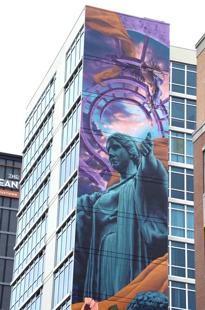 A campustown mural of the kingfisher on the side of the Skyline Tower building in Champaign, Illinois