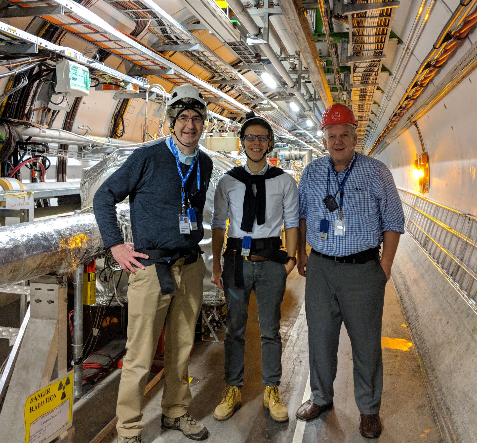Pictured left to right, University of Kansas Physics &amp;amp;amp; Astronomy Professor Michael Murray, Illinois Physics Research Scientist Riccardo Longo, and Illinois Physics Professor Matthias Grosse Perdekamp pose for a photo at the Large Hadron Collider at CERN. Photo courtesy of Matthias Grosse Perdekamp, Illinois Physics.